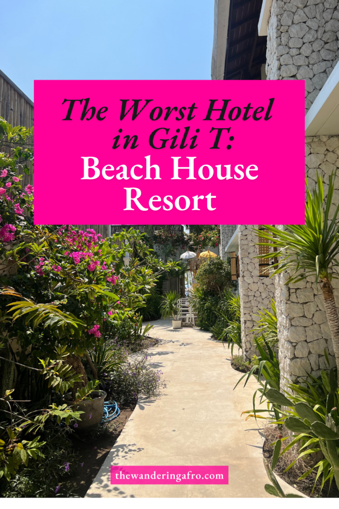 Text reads: The Worst Hotel in Gilii T: Beach House Resort. Background is lots of flowers in an alley way at Beach House resort