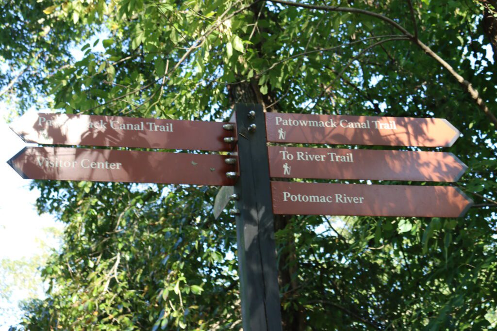 a sign with different trail names at Great Falls Park