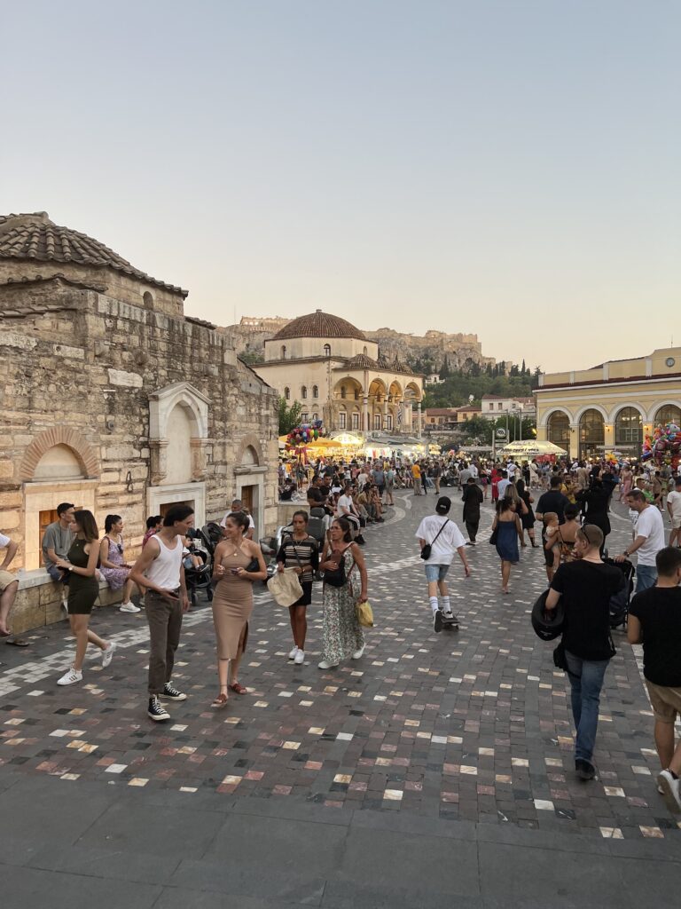 Busy open flea market in Monastiraki Athens at dusk 