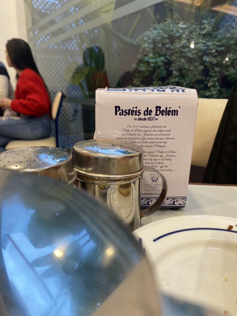 a menu and table at Pasteis de Belem 