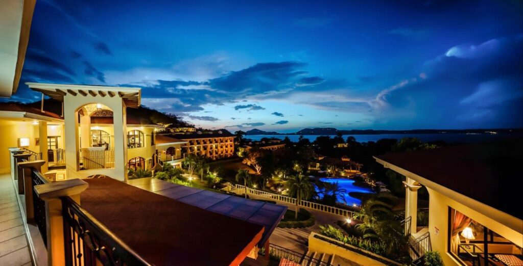 Nighttime view of Occidental Papagayo - Adults Only All Inclusive hotel and pool 