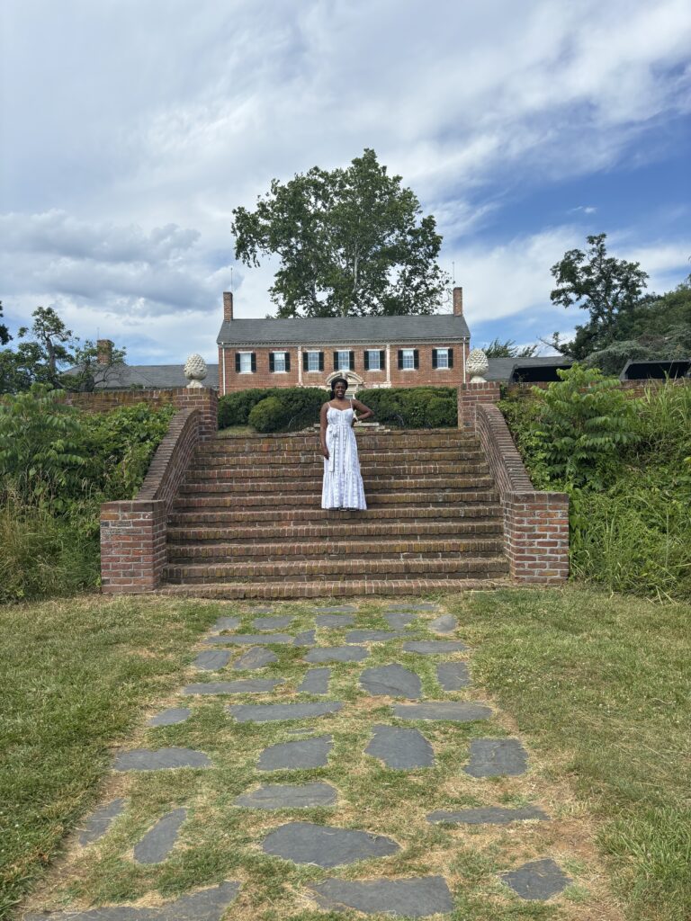 Black woman standing in front of Chatham manor in Fredericksburg