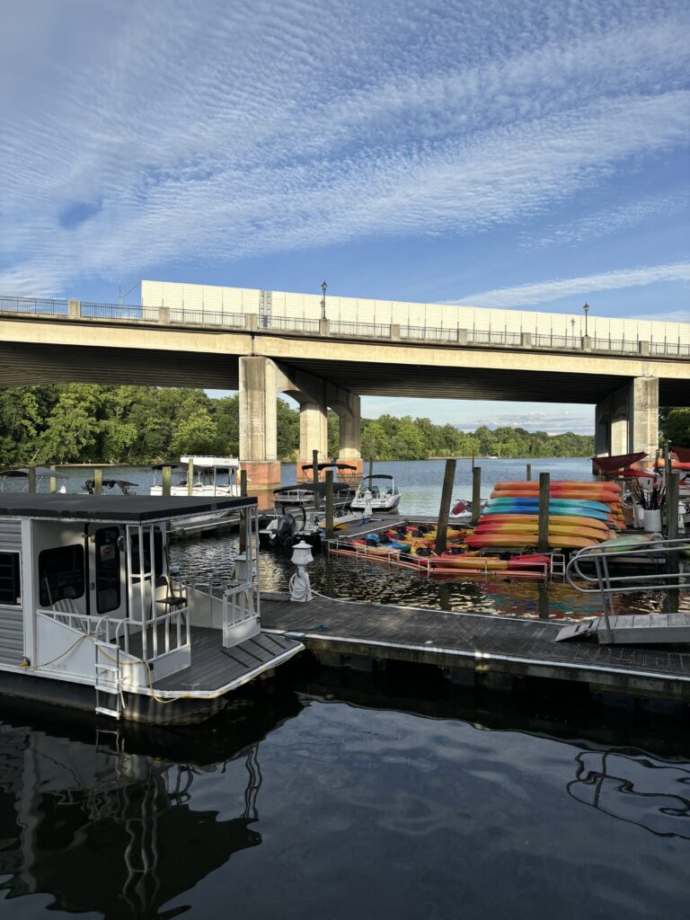 colorful kayaks and a houseboat in Occoquan