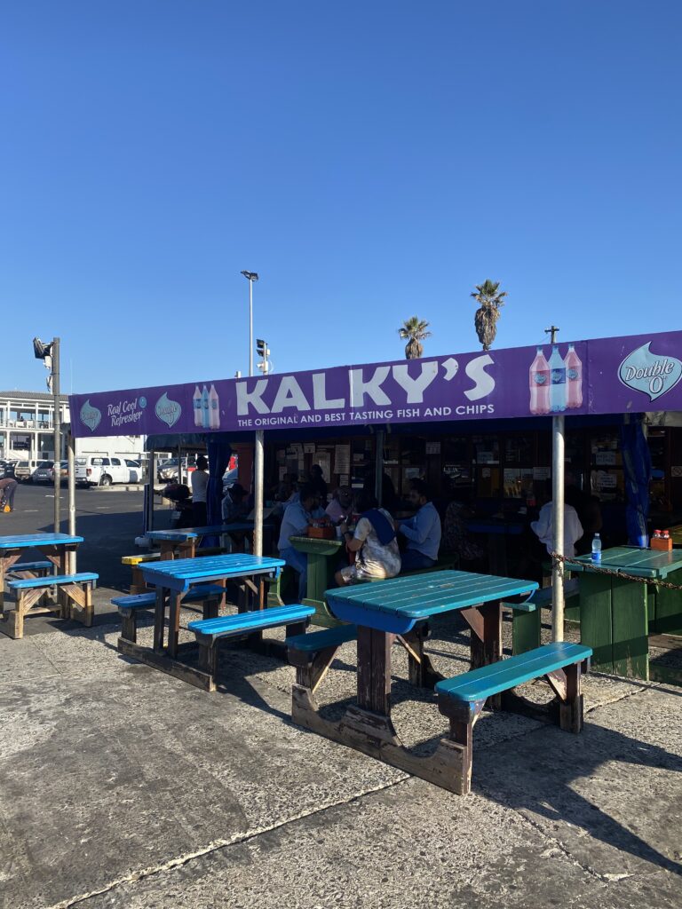 a purple sign that says, Kalky's with outdoor seating