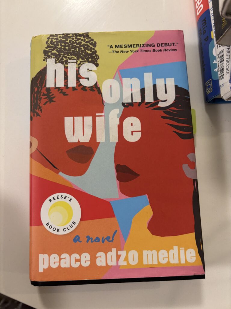 a book cover with two dark skinned women and the title "his only wife' at sankofa bookstore in dc