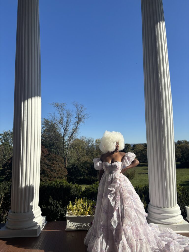 Black woman with blonde afro wearing a puffy selkie dress at Rosemont Manor