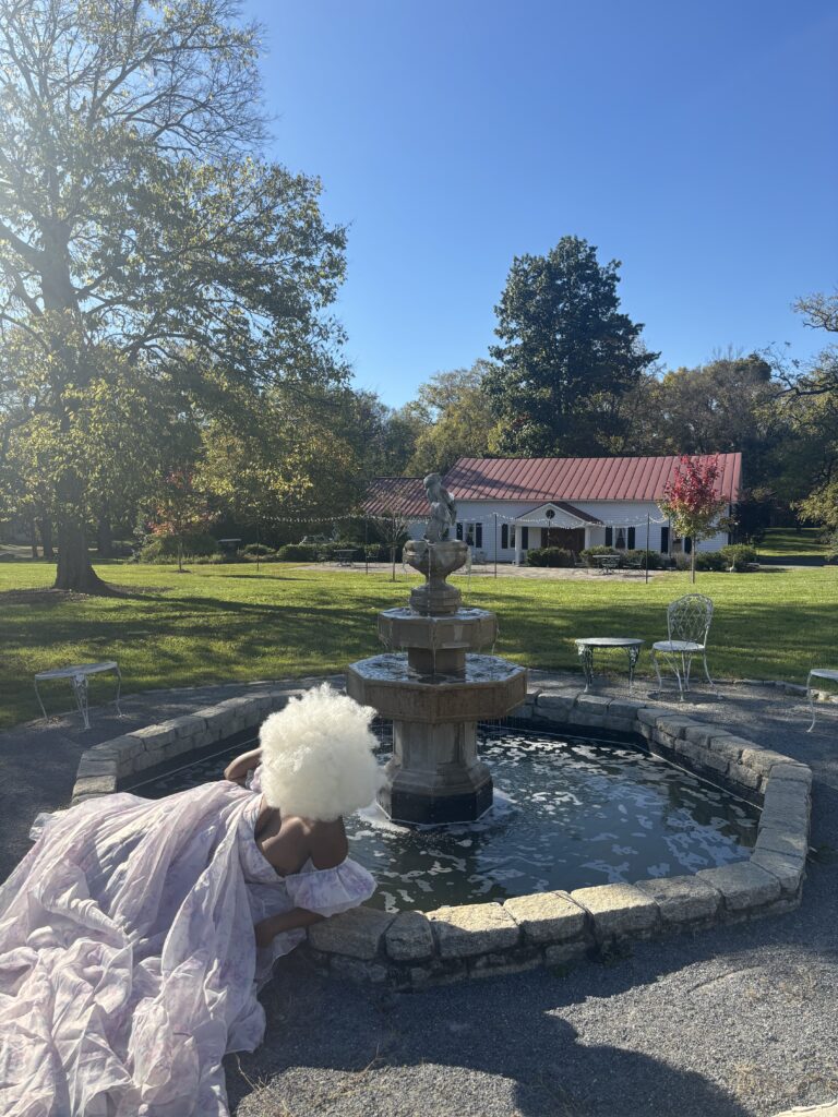 Black woman in dress at Rosemant Manor