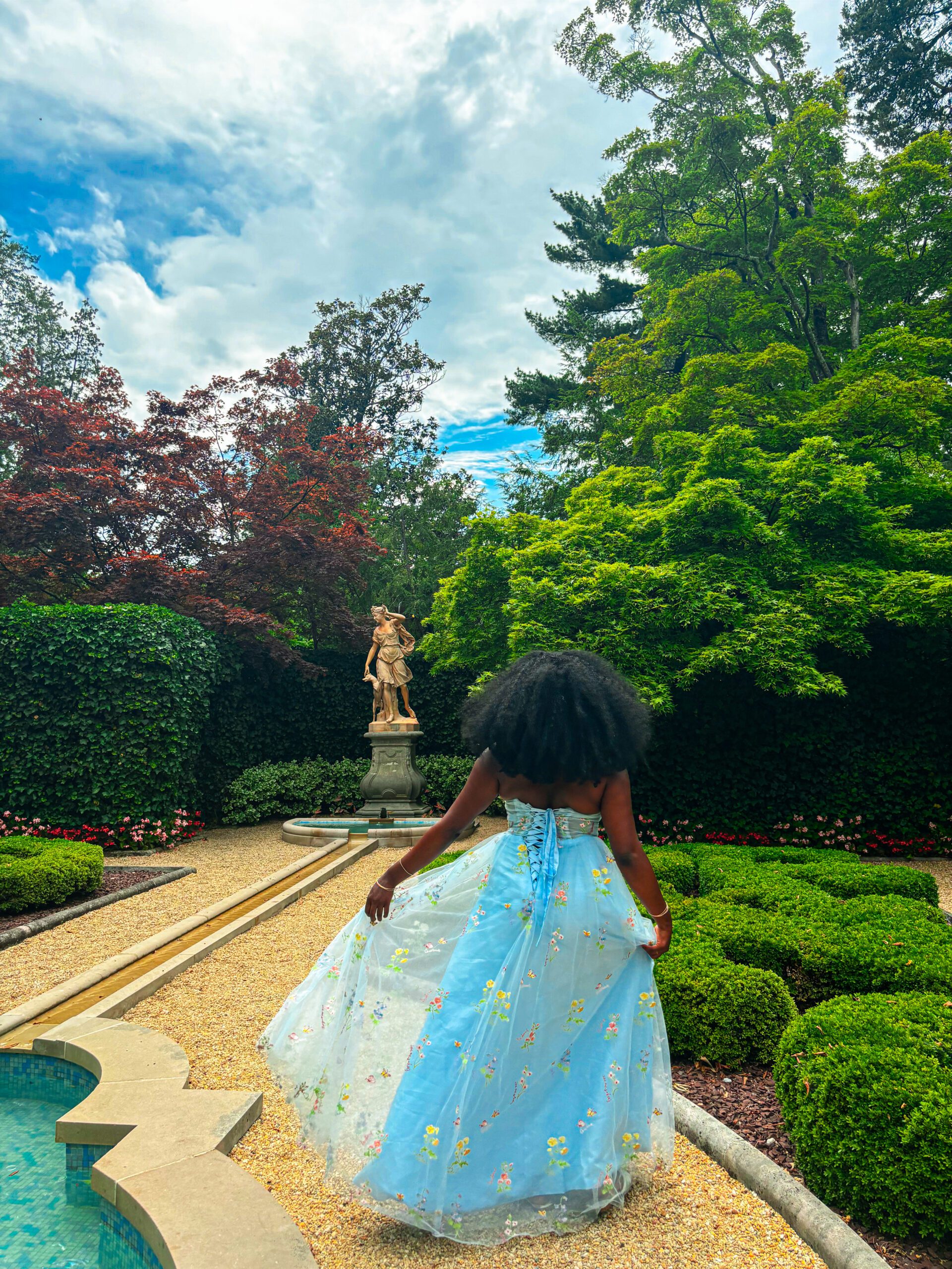 a woman wearing a princess dress embodying the soft life