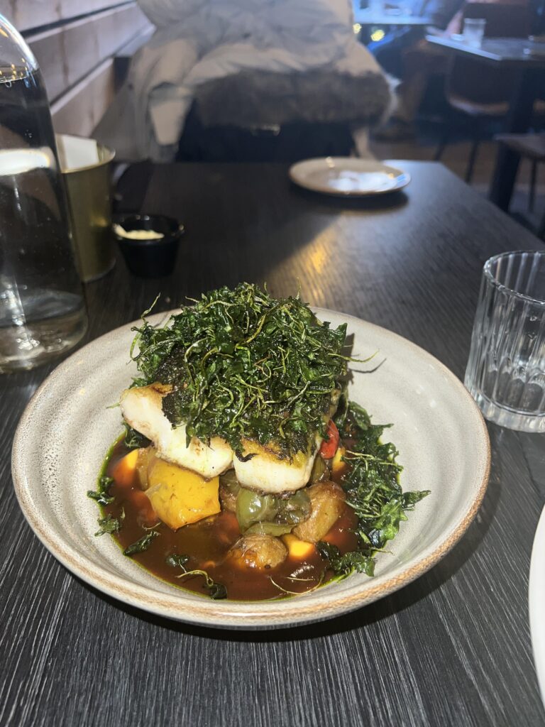 fish , vegetables, and potatoes at a nice restaurant in Reykjavik Iceland